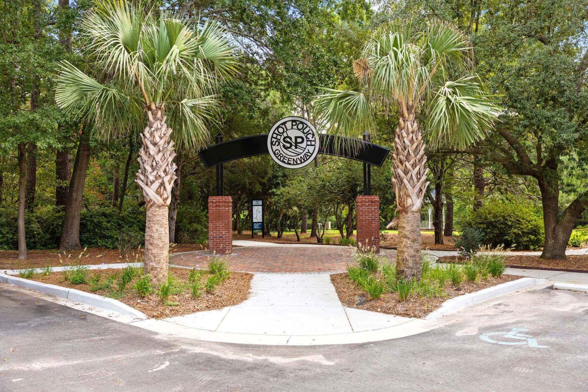 entrance to shot pouch greenway at swan lake iris gardens