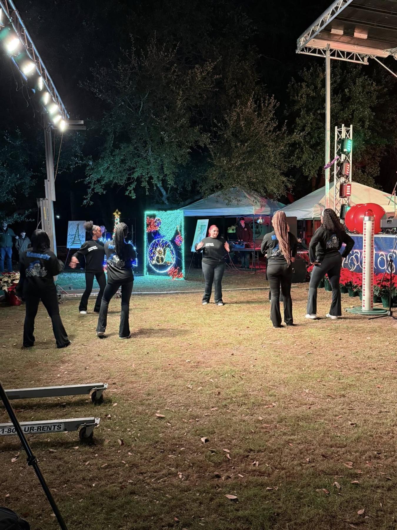 Performers prepare for their dance number.